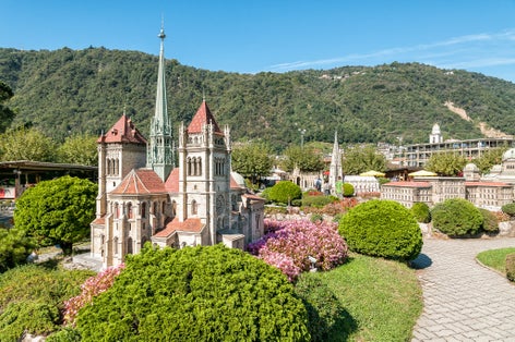 photo of Swissminiatur park in Melide, is an open-air museum with the most important Swiss buildings and means of transportation. Saint Pierre cathedral.
