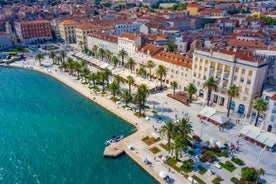 photo of a beautiful panoramic view of Kastel Luksic harbor and landmarks summer view, Split region of Dalmatia, Croatia.