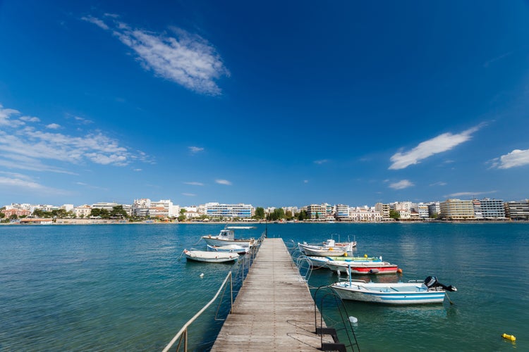 Photo of boats tied at small harbour in Chalkida, Evia, Greece.