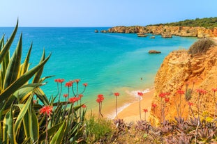 Photo of Carvoeiro fishing village with beautiful beach and colourful houses, Portugal.