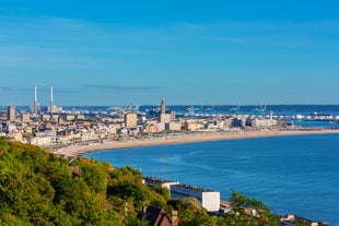 photo of Port of Deauville and city skyline in a sunny summer day, Normandy, France.