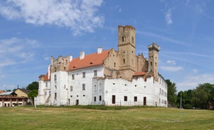 Photo of Lednice Chateau with beautiful gardens and parks on a sunny summer day, Czech Republic.