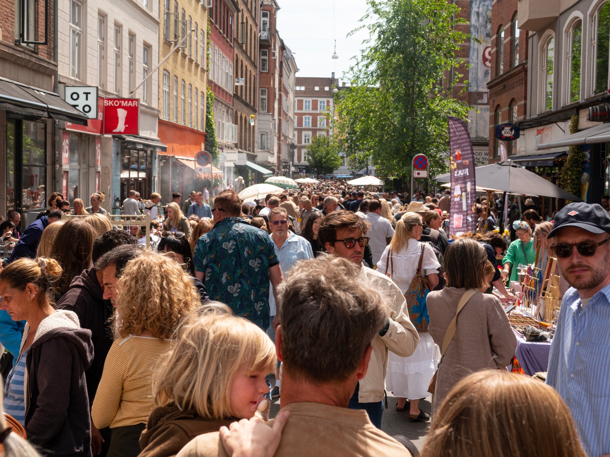 Street with flea market full of crowd of people. Copenhagen, Denmark.jpg