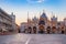 Photo of sunrise in San Marco square with Campanile and San Marco's Basilica, the main square of the old town, Venice, Veneto Italy.