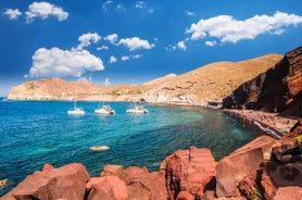 Photo of scenic aerial view of Kamari village and beach at sunrise, Greece.