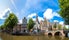 photo of Oude Kerk (Old Church) and Voorburgwal canal in Amsterdam.