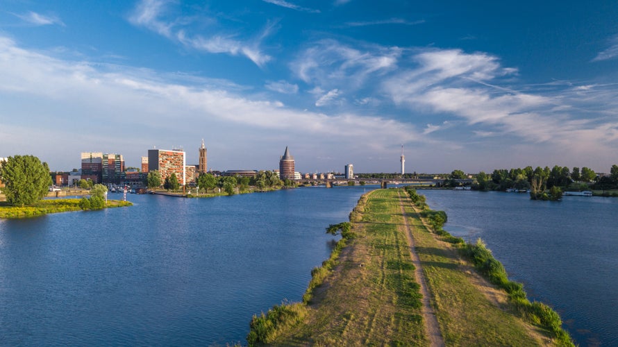 Beautiful drone shot of the skyline of Roermond at the river the Maas.