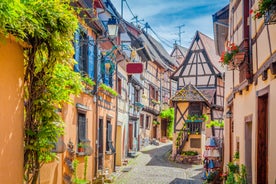 Photo of traditional half-timbered houses on picturesque canals in La Petite France in the medieval fairytale town of Strasbourg, France.