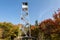 photo of Mt Arab fire tower in Adirondacks surrounded by fall foliage .