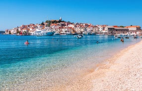 Photo of panorama and landscape of Makarska resort and its harbour with boats and blue sea water, Croatia.