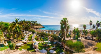 photo of aerial view of the beach and lagoon of Los Cristianos resort on Tenerife, Canary Islands, Spain.