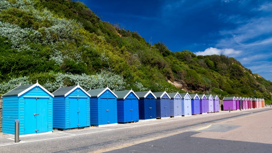 Photo of colourful wooden beach huts at Bournemouth on the South Coast of England UK Europe.