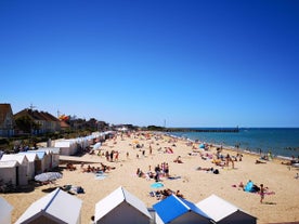 Photo of aerial view of the long sandy beach of Sword beach in Hermanville-sur-Mer towards Ouistreham ,France.