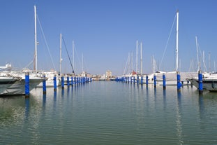 Photo of Cervia's canal, where the Salt Museum is located, with reflections on the water ,Italy.