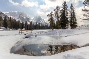 photo of the romantic, Snow covered Skiing Resort of Cortina d Ampezzo in the Italian Dolomites seen from Tofana with Col Druscie in the foreground.