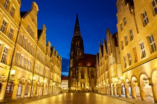 Photo of scenic summer view of the German traditional medieval half-timbered Old Town architecture and bridge over Pegnitz river in Nuremberg, Germany.