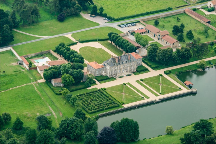 photo of view of aerial view of the castle of Asson at La Boissière-de-Montaigu in France.