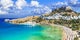 Photo of panoramic aerial view of Lindos bay, village and Acropolis, Rhodes, Greece.