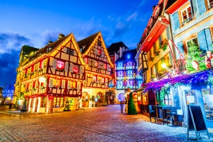 Photo of traditional half-timbered houses on picturesque canals in La Petite France in the medieval fairytale town of Strasbourg, France.