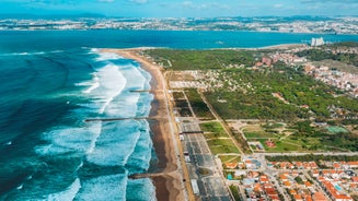 Photo of aerial view of Costa da Caparica coastline of glorious sandy beaches, powerful Atlantic waves, Portugal.