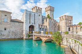 Photo of aerial view of Verona historical city centre, Ponte Pietra bridge across Adige river, Verona Cathedral, Duomo di Verona, red tiled roofs, Veneto Region, Italy.