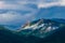 Photo of Mount Olympus, Cyprus, amazing cloudy mountain peak with a rainbow.