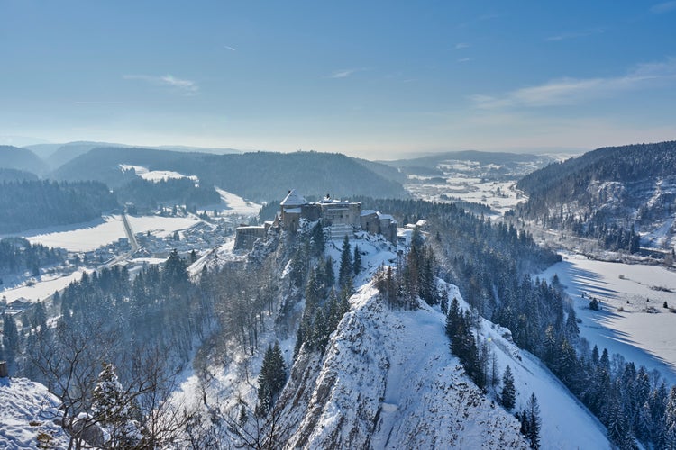 photo of view of Views of Chateau de Joux Covered In Snow - La Cluse et Mijoux - France.