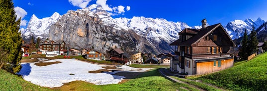 Photo of beautiful autumn view of Lauterbrunnen valley with gorgeous Staubbach waterfall and Swiss Alps at sunset time, Switzerland.