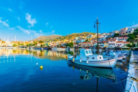 Photo of aerial view of Pythagorio port with colourful houses and blue sea, Samos island, Greece.