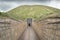 photo of Gordion antique city. Tumulus and entrance to tomb of King Midas of Phrygia. Yassihoyuk (yassıhöyük), Gordium, Ankara, Turkey.