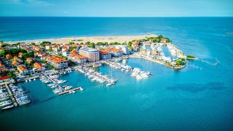 Photo of Trieste lighthouse Phare de la Victoire and cityscape panoramic aerial view, Friuli Venezia Giulia region of Italy.