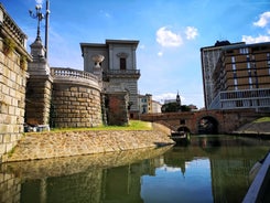 Photo of beautiful view of canal with statues on square Prato della Valle and Basilica Santa Giustina in Padova (Padua), Veneto, Italy.