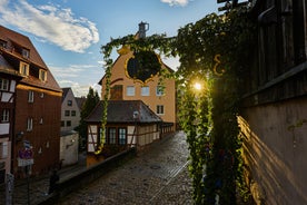 Photo of scenic summer view of the German traditional medieval half-timbered Old Town architecture and bridge over Pegnitz river in Nuremberg, Germany.