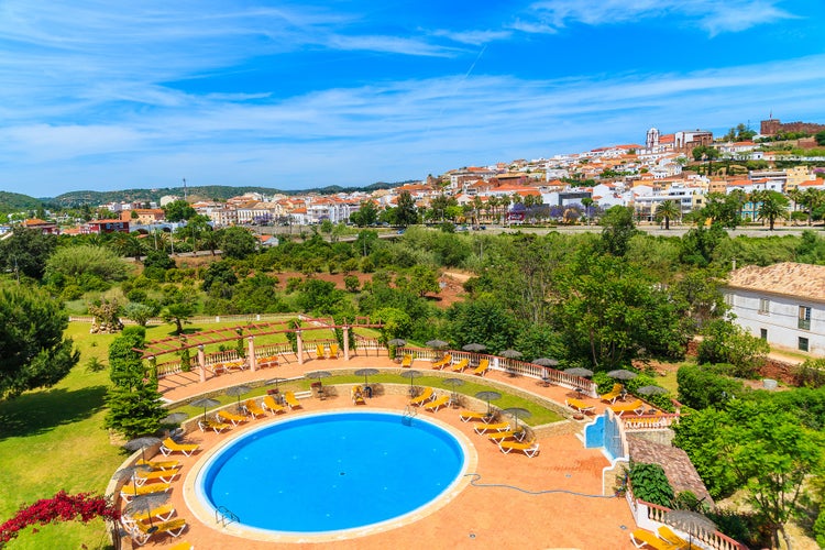 View of Silves town buildings and pool of luxury hotel, Algarve region, Portugal