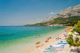 Photo of panorama and landscape of Makarska resort and its harbour with boats and blue sea water, Croatia.