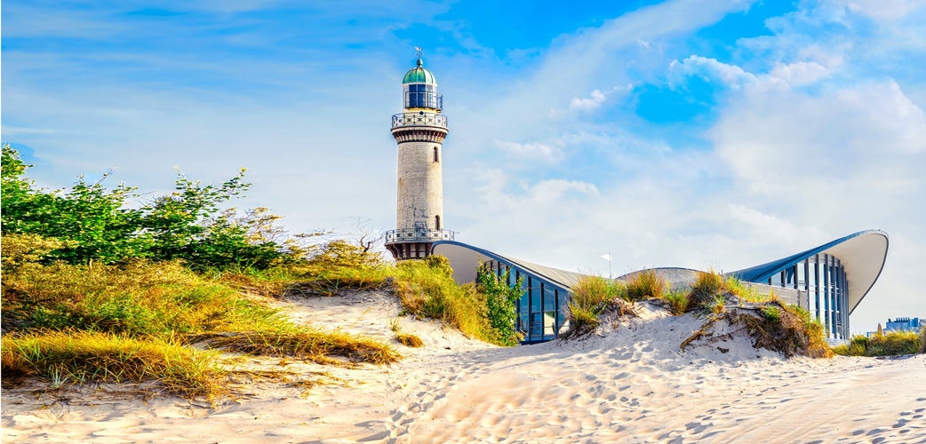 Photo of banner with lighthouse in Warnemunde Rostock in Germany Baltic sea vacation and travel destinations.