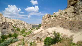 Hot air balloons flying over Uchisar Castle. Cappadocia. Nevsehir Province. Turkey.