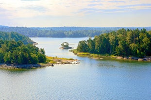 Early autumn morning panorama of the Port of Turku, Finland, with Turku Castle at background.