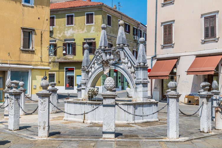 A view towards the Da Ponte fountain in Koper, Slovenia in summertime