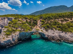 Photo of Heraion in Perachora with small beach, Loutraki, Greece.