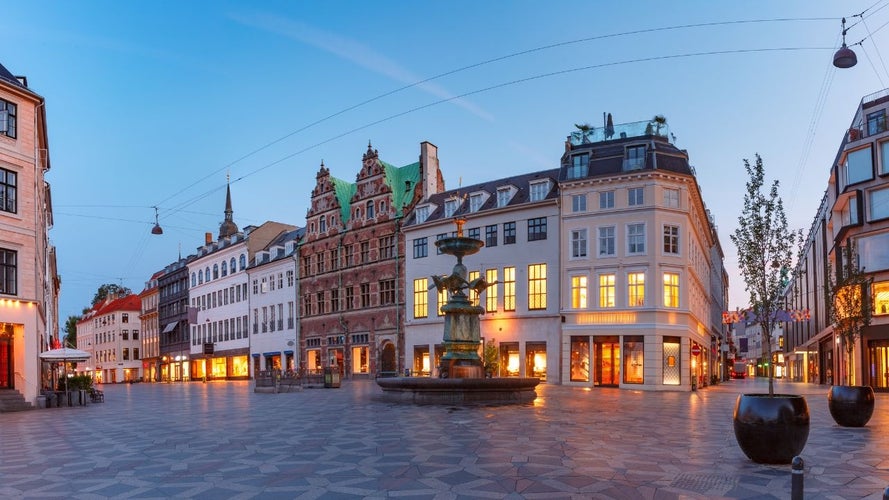 Strøget, Copenhagen-s popular pedestrian street, with historic buildings and the Stork Fountain at dusk..jpg