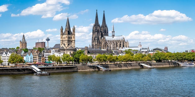 Photo of Cologne city skyline in summer along the Rhine river, North Rhine-Westphalia, Germany.