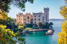 Photo of Trieste lighthouse Phare de la Victoire and cityscape panoramic aerial view, Friuli Venezia Giulia region of Italy.