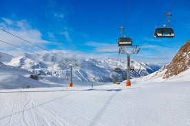 Photo of The mountain village at the Austrian ski resort Soelden on a cold and sunny winter day.