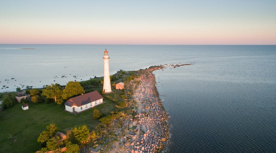 Seascape view with the historic lighthouse building in the seacoast of the Kihnu island, Pärnu county, Estonia