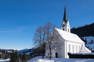 photo of village of Hirschegg in the Kleinwalsertal, Vorarlberg, Austria, with Gottesackerplateau in the background.