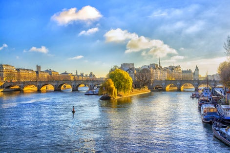 photo of Pont Neuf and river Seine waters at beautiful morning in Paris, France.