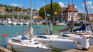 photo of Port of Deauville and city skyline in a sunny summer day, Normandy, France.