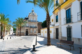 Photo of Carvoeiro fishing village with beautiful beach and colourful houses, Portugal.