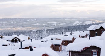 photo of beautiful vibrant aerial winter mountain view of ski resort Trysil, Norway. sunny winter day with slope, piste and ski lift.